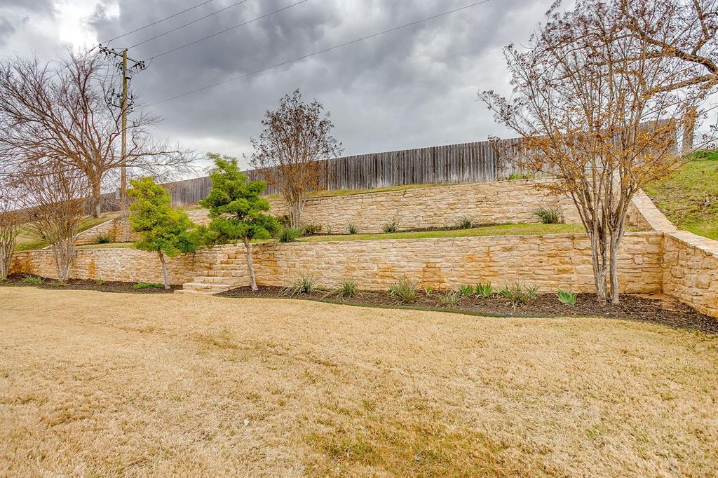 9815 Ravenswood Road Granbury, TX 76049 - Photo 40 of 40 a view of a yard with an outdoor space