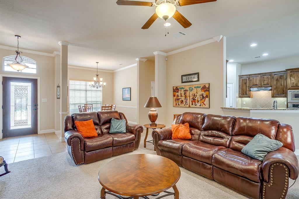 9815 Ravenswood Road Granbury, TX 76049 - Photo 10 of 40 a living room with furniture and a large window