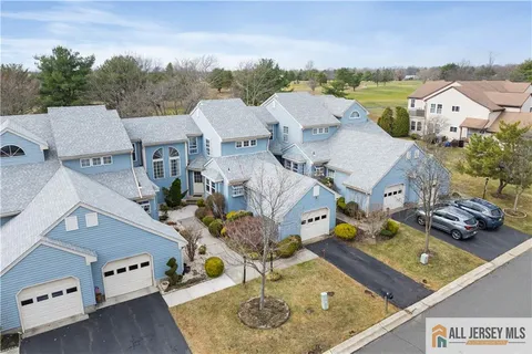 an aerial view of a house with outdoor space
