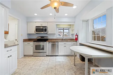 a kitchen with a stove and a sink