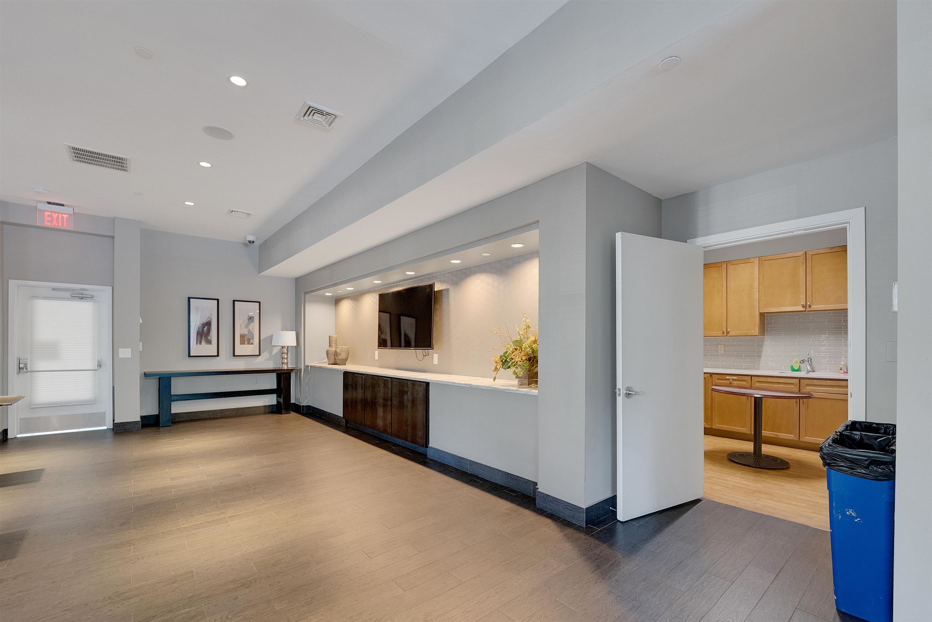 26 Ave At Port Imperial, Unit 440X West New York, NJ 07093 - Photo 27 of 36 a living room with furniture and a kitchen