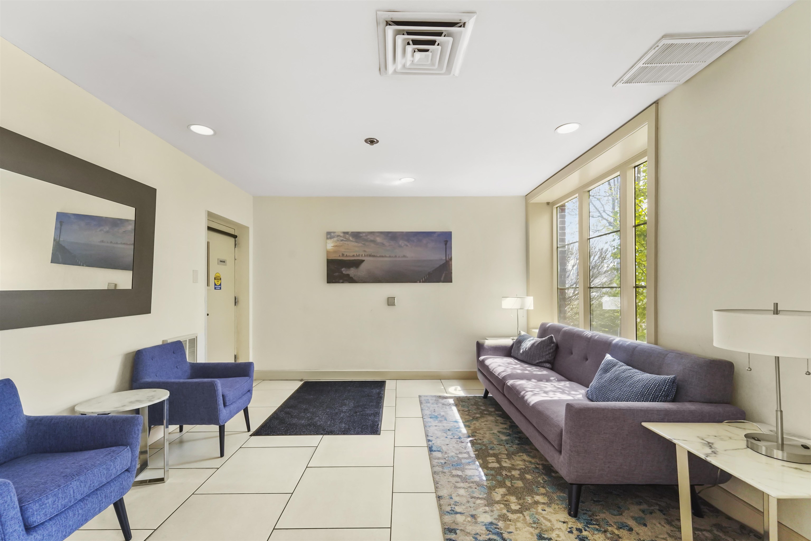 26 Ave At Port Imperial, Unit 440X West New York, NJ 07093 - Photo 33 of 36 a living room with furniture and a window