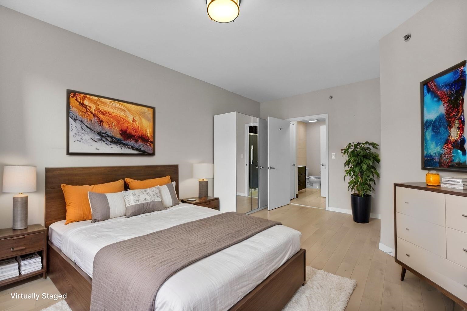 26 Ave At Port Imperial, Unit 440X West New York, NJ 07093 - Photo 6 of 36 a bedroom with bed and a chandelier