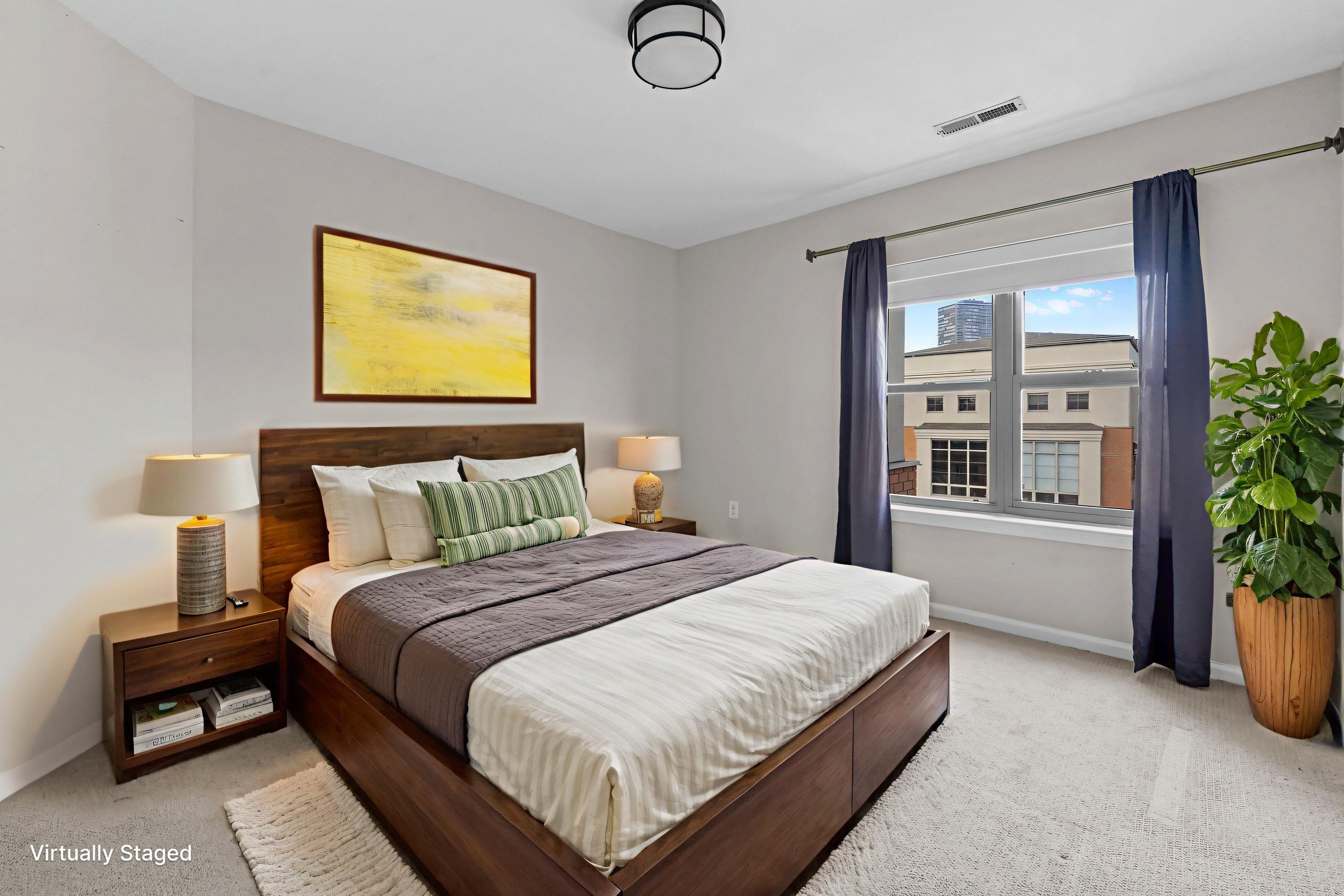 26 Ave At Port Imperial, Unit 440X West New York, NJ 07093 - Photo 7 of 36 a bedroom with a bed and potted plant next to a window
