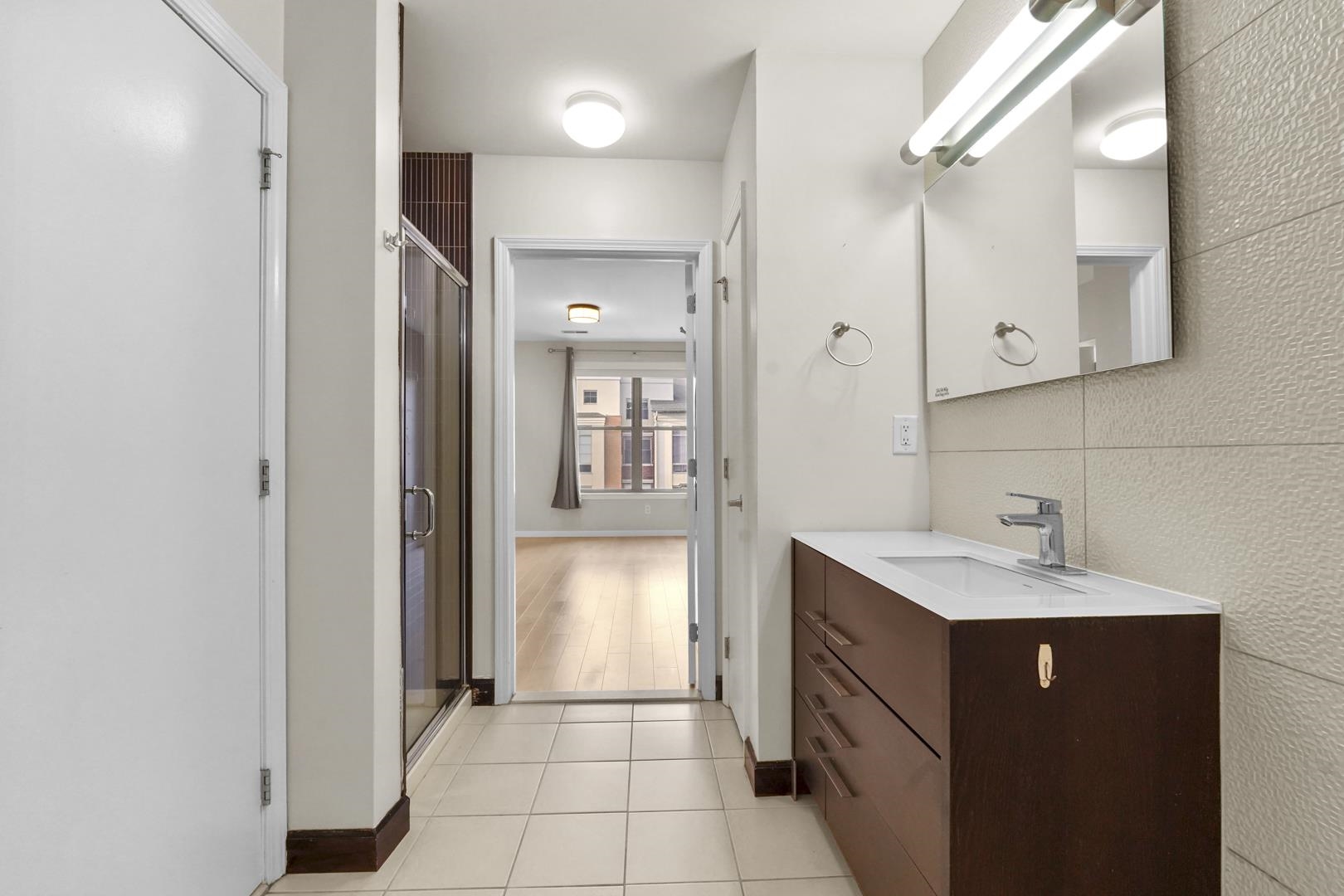 26 Ave At Port Imperial, Unit 440X West New York, NJ 07093 - Photo 10 of 36 a bathroom with a sink and a mirror