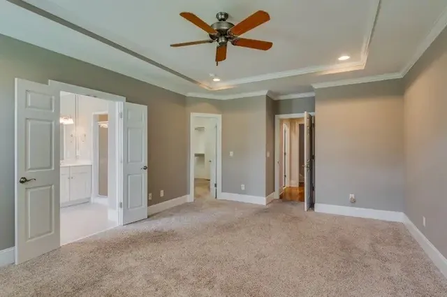 a view of a livingroom with a ceiling fan