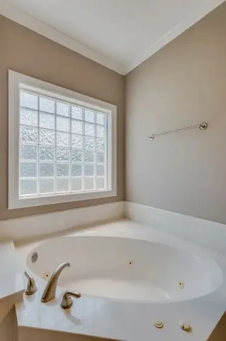 a bathroom with a tub and a sink