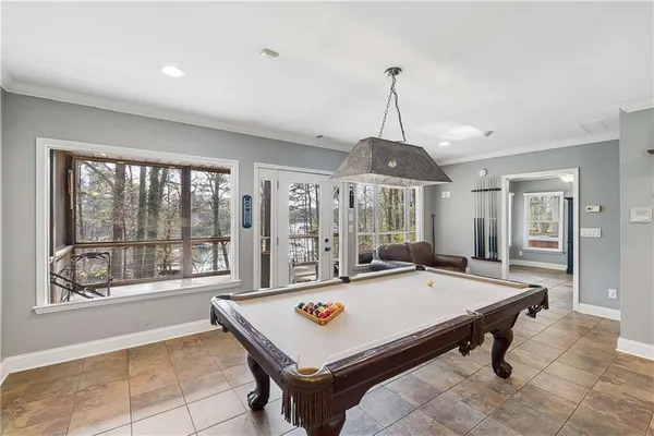a view of swimming pool with chairs in patio
