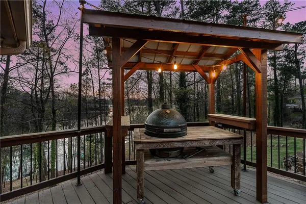 a view of a patio with a table chairs and backyard