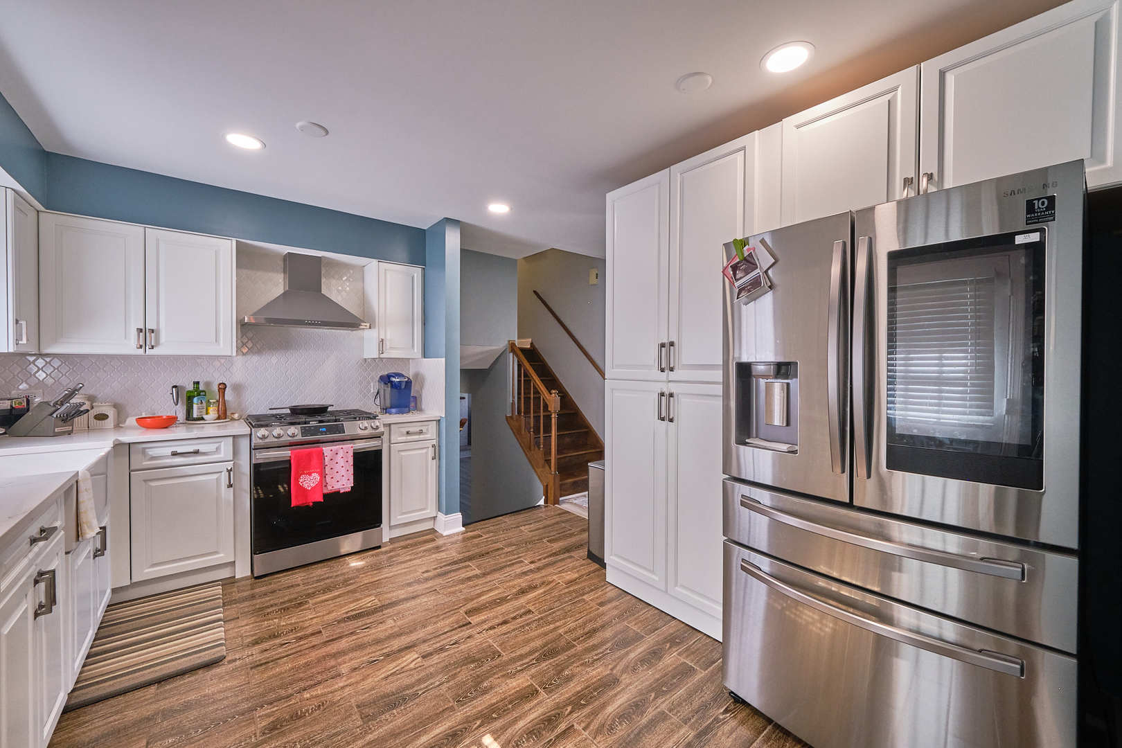 1115 Birch Road Homewood, IL 60430 - Photo 14 of 47 a kitchen with granite countertop a refrigerator and a stove top oven