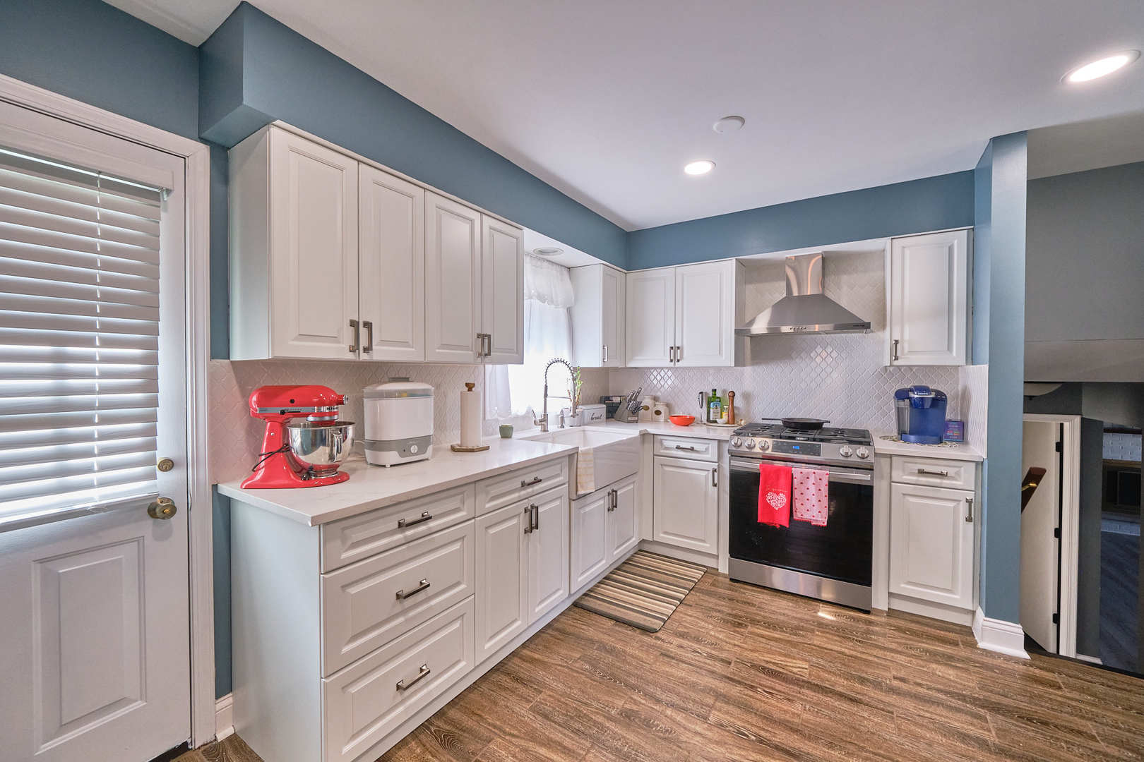 1115 Birch Road Homewood, IL 60430 - Photo 15 of 47 a kitchen with granite countertop a stove top oven sink and cabinets