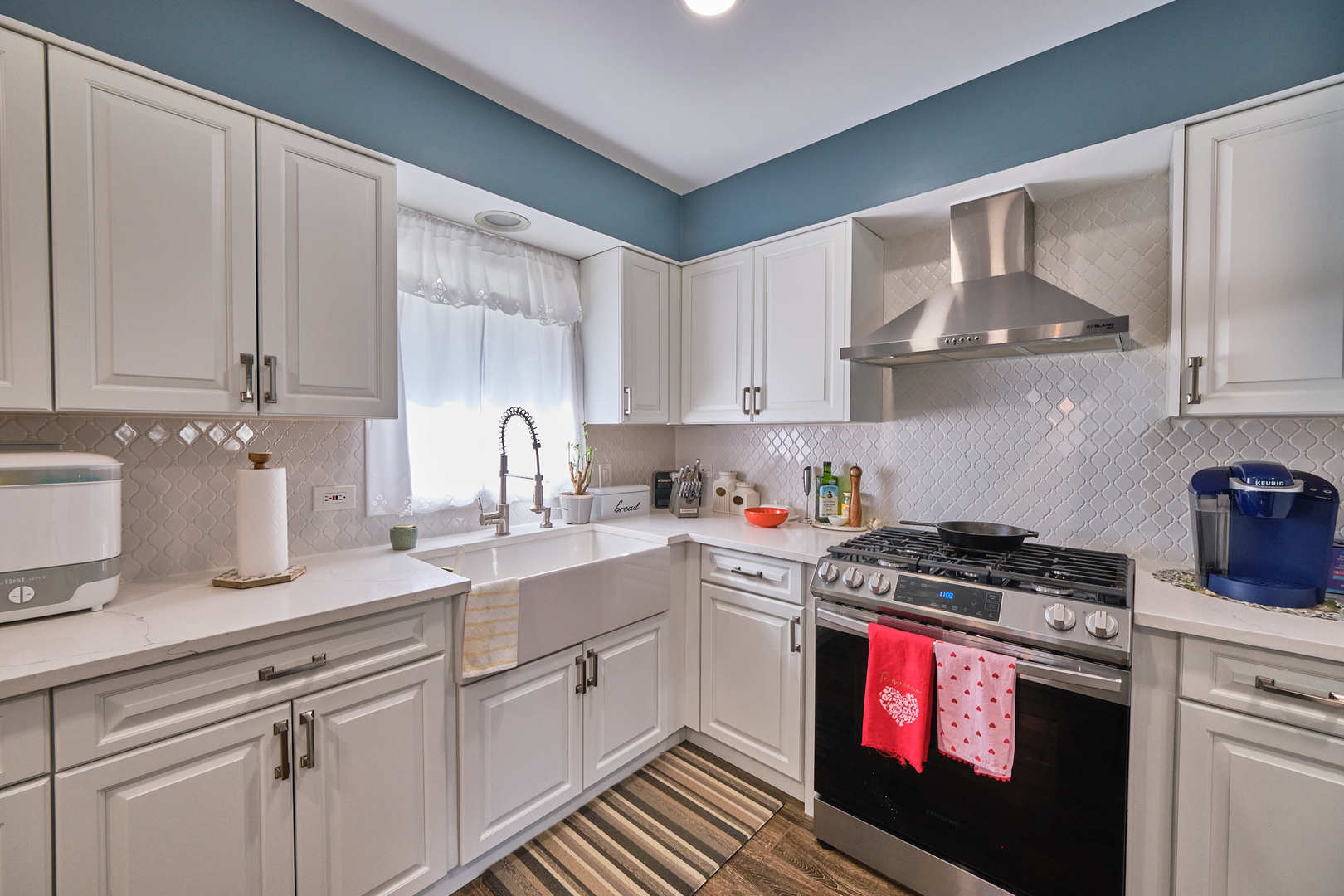 1115 Birch Road Homewood, IL 60430 - Photo 17 of 47 a kitchen with stainless steel appliances granite countertop a sink stove and cabinets