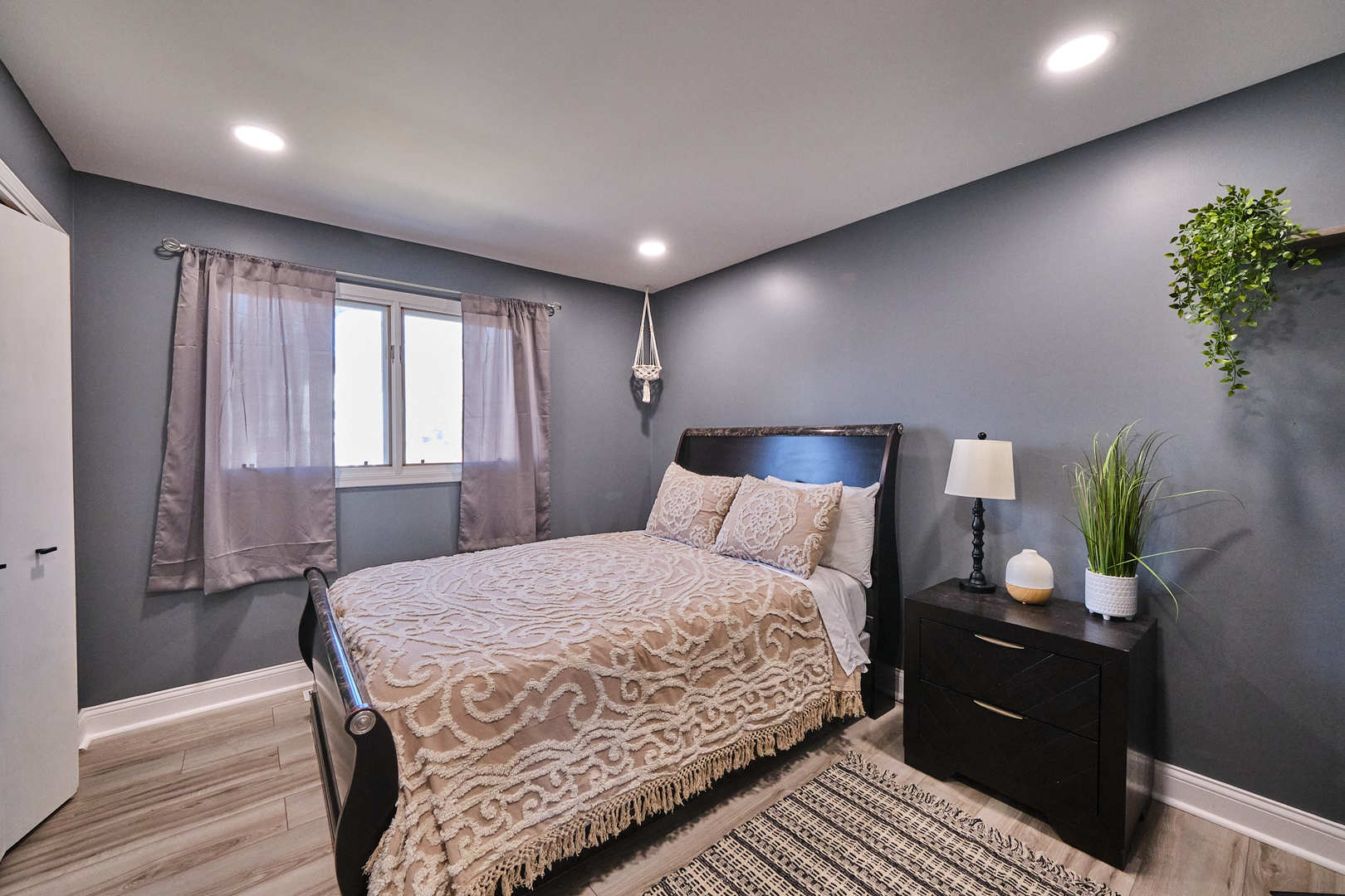 1115 Birch Road Homewood, IL 60430 - Photo 33 of 47 a bedroom with a bed and a potted plant