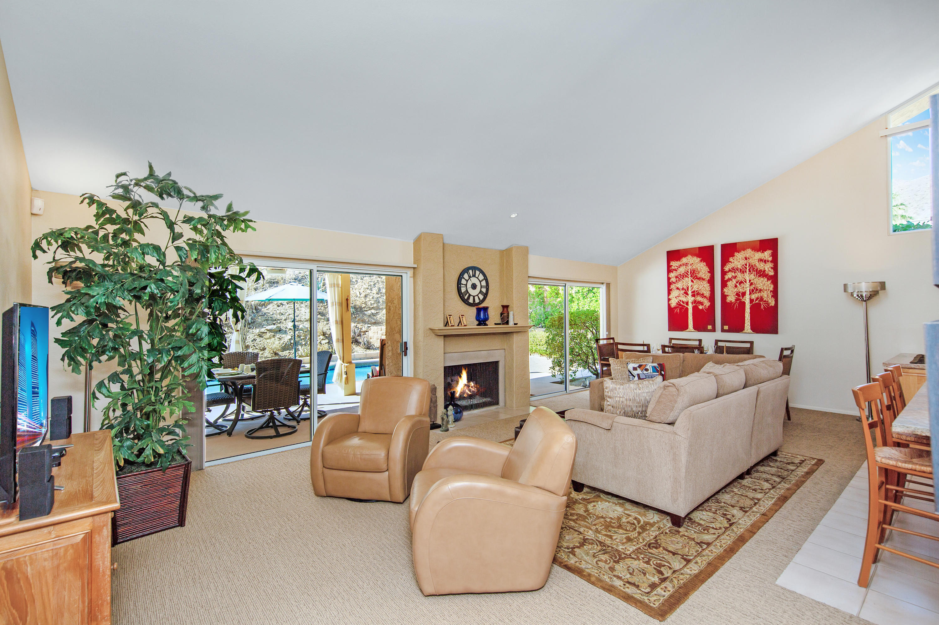 67825 Foothill Road Cathedral City, CA 92234 - Photo 5 of 48 a living room with furniture flower pot and a fireplace