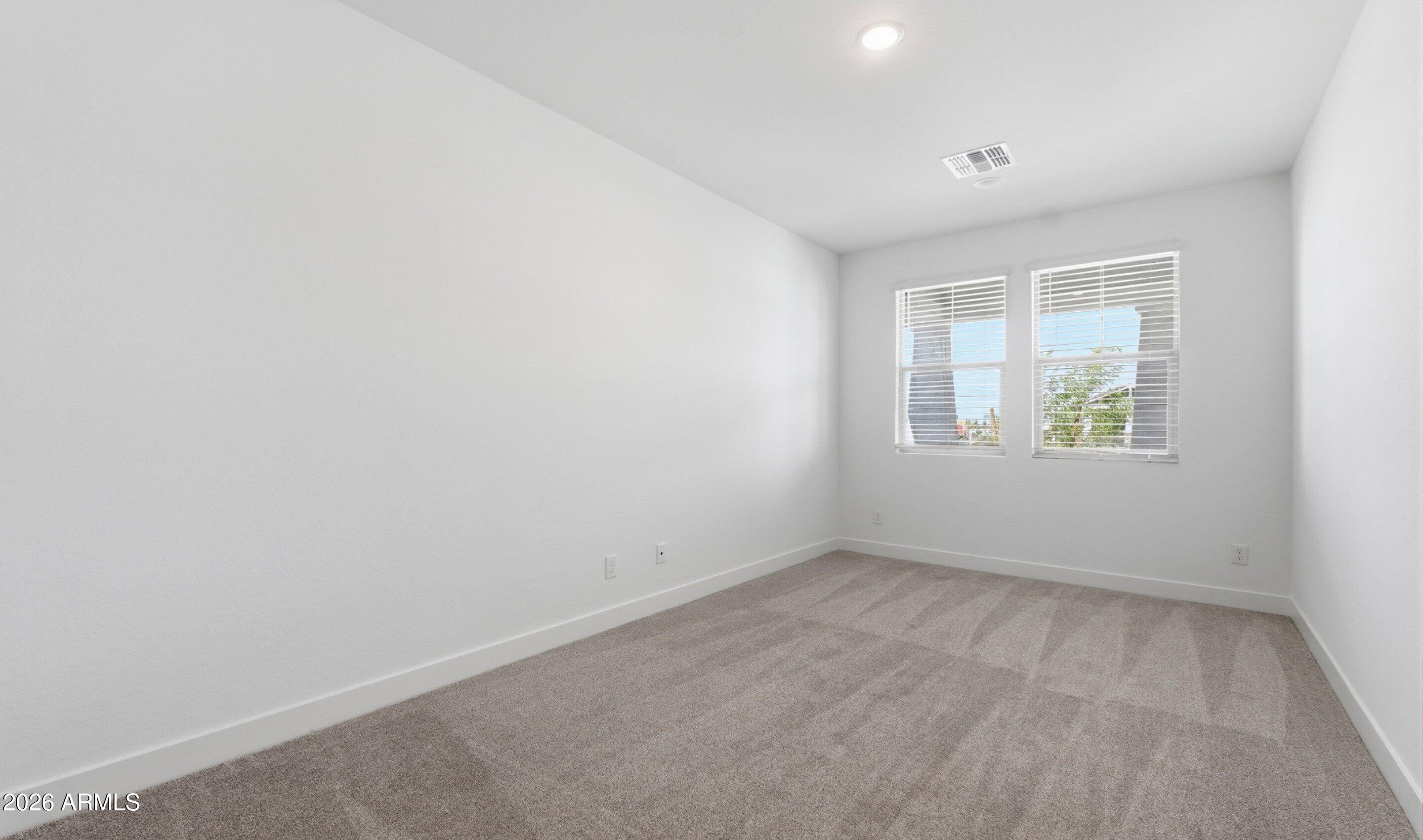 7779 West Sands Road Glendale, AZ 85303 - Photo 20 of 37 an empty room with windows