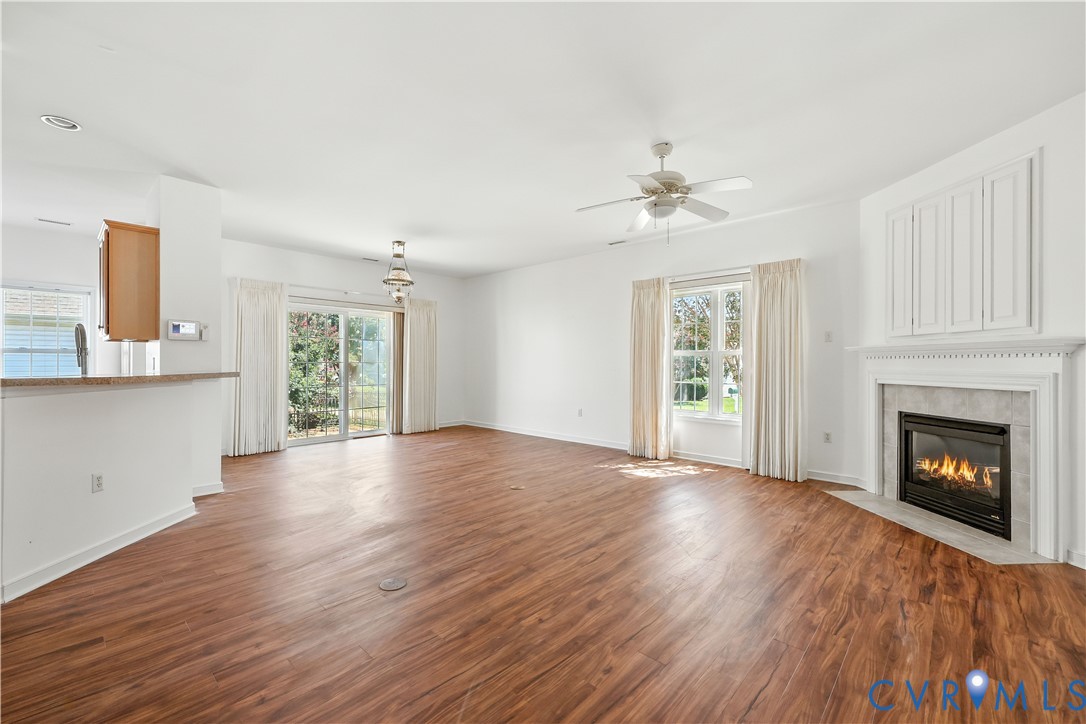695 Krim Point Loop Midlothian, VA 23114 - Photo 12 of 29 Unfurnished living room featuring wood finished fl