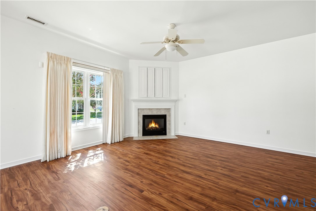 695 Krim Point Loop Midlothian, VA 23114 - Photo 14 of 29 Unfurnished living room featuring a fireplace, dar