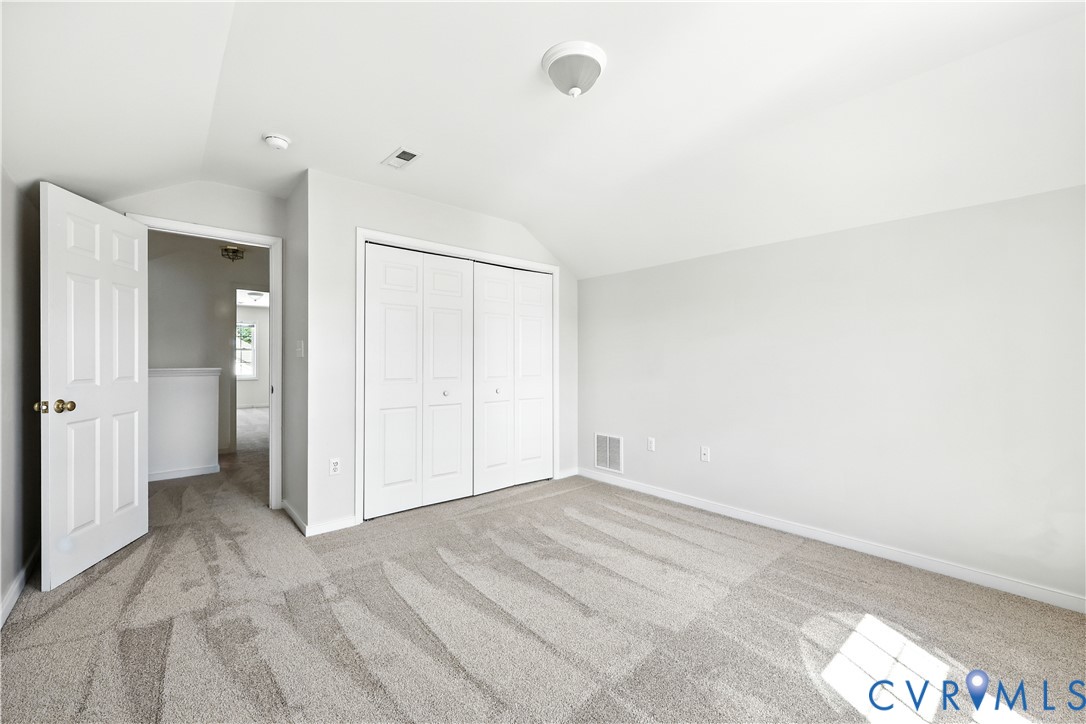 695 Krim Point Loop Midlothian, VA 23114 - Photo 27 of 29 Unfurnished bedroom with light colored carpet, lof