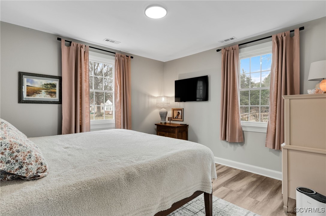 206 West McClellan Street Sandston, VA 23150 - Photo 16 of 24 a bedroom with a bed and a flat screen tv