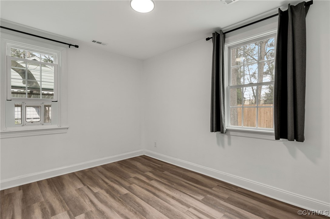 206 West McClellan Street Sandston, VA 23150 - Photo 18 of 24 a view of empty room with wooden floor and fan