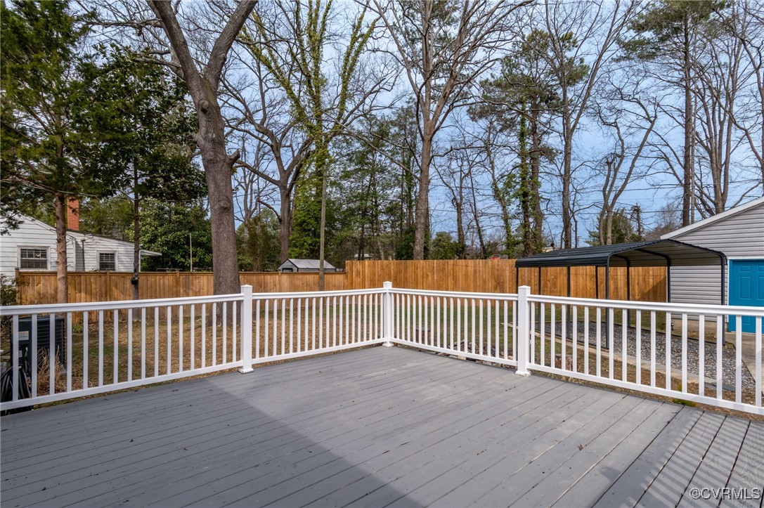 206 West McClellan Street Sandston, VA 23150 - Photo 21 of 24 a view of a street with wooden fence and trees