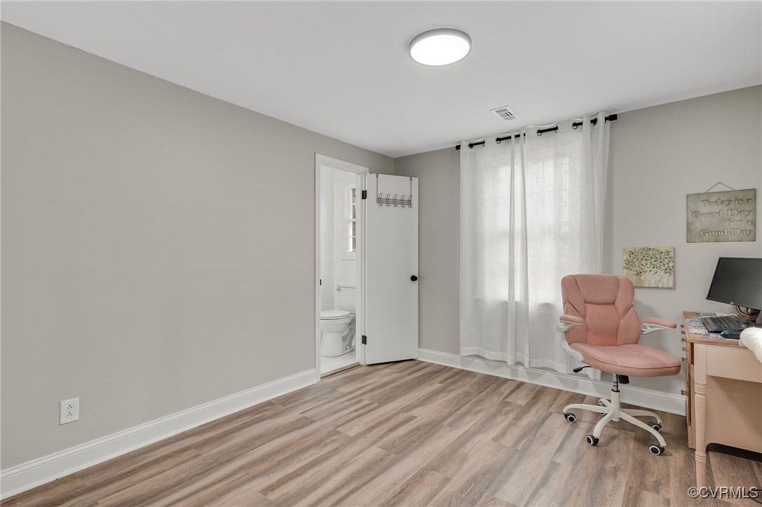 206 West McClellan Street Sandston, VA 23150 - Photo 8 of 24 an empty room with wooden floor and furniture