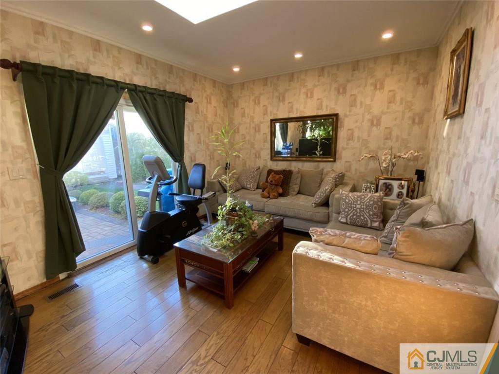58 Brookside Road Edison, NJ 08817 - Photo 11 of 34 a living room with furniture and a large window
