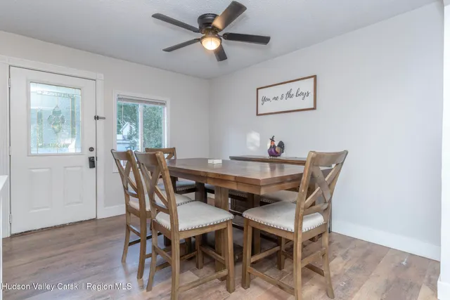 a dining room with furniture and window