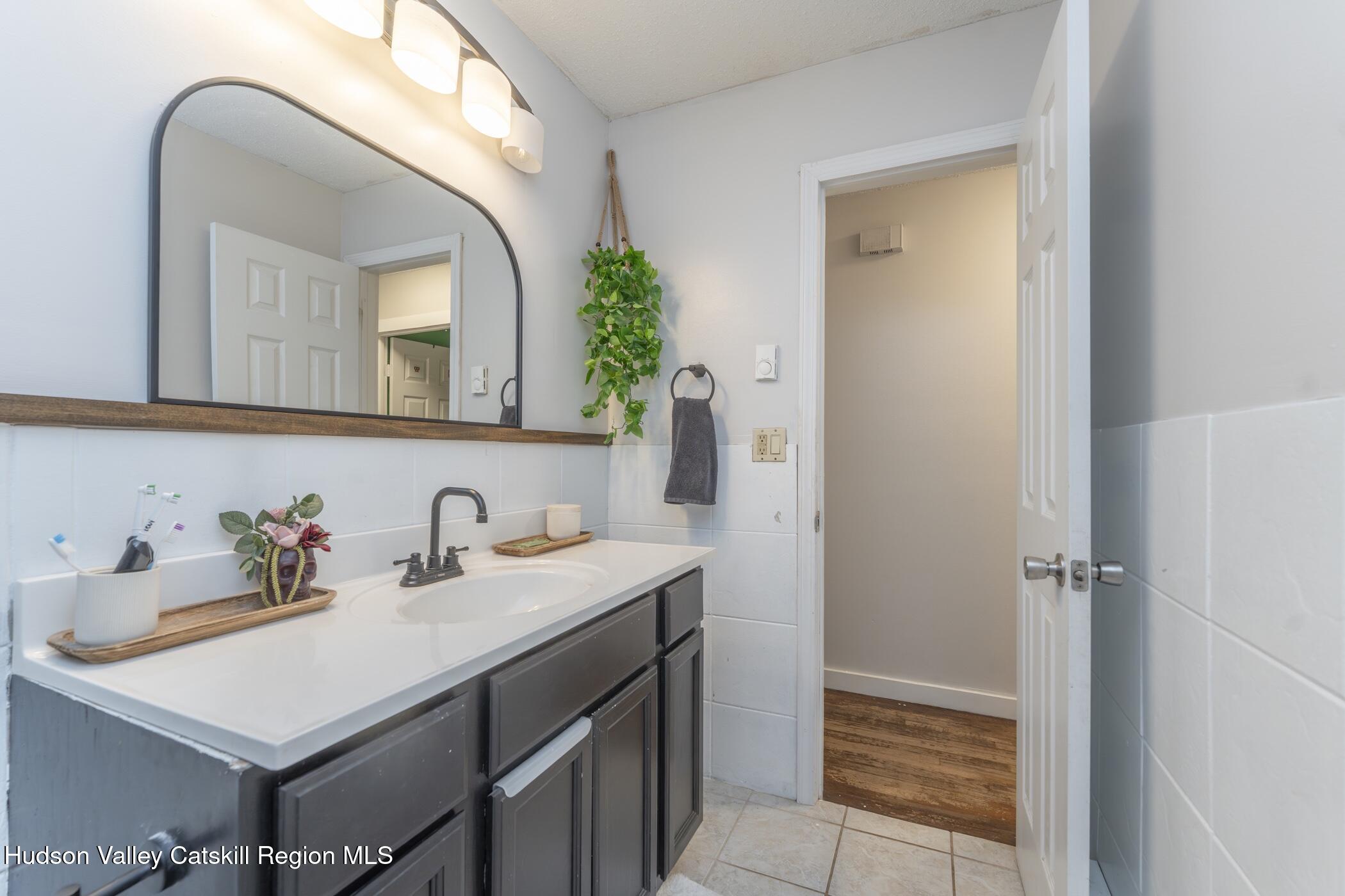 30 Willow Road Saugerties, NY 12477 - Photo 20 of 40 a bathroom with a sink and a mirror