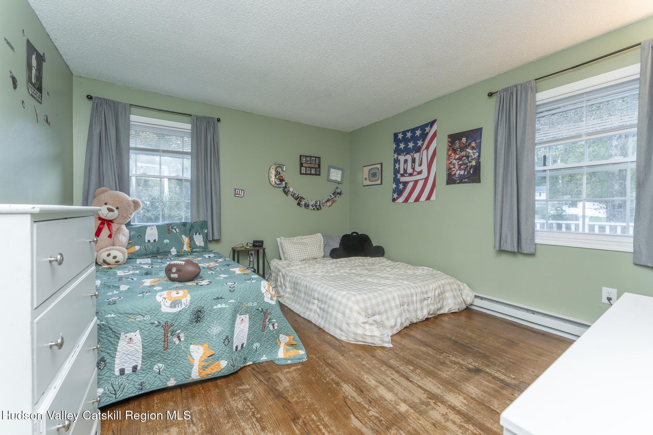 30 Willow Road Saugerties, NY 12477 - Photo 21 of 40 a bedroom with two beds and a window