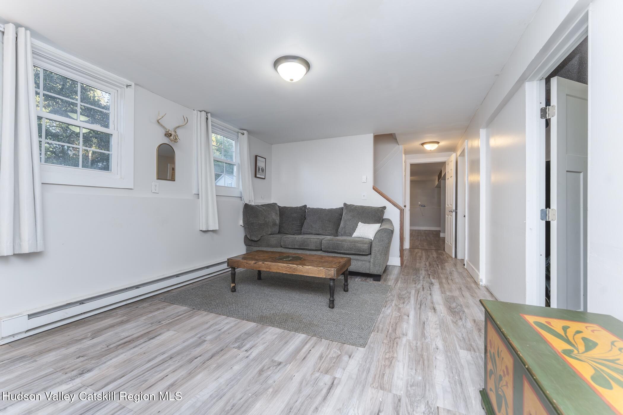 30 Willow Road Saugerties, NY 12477 - Photo 24 of 40 a living room with furniture and a wooden floor
