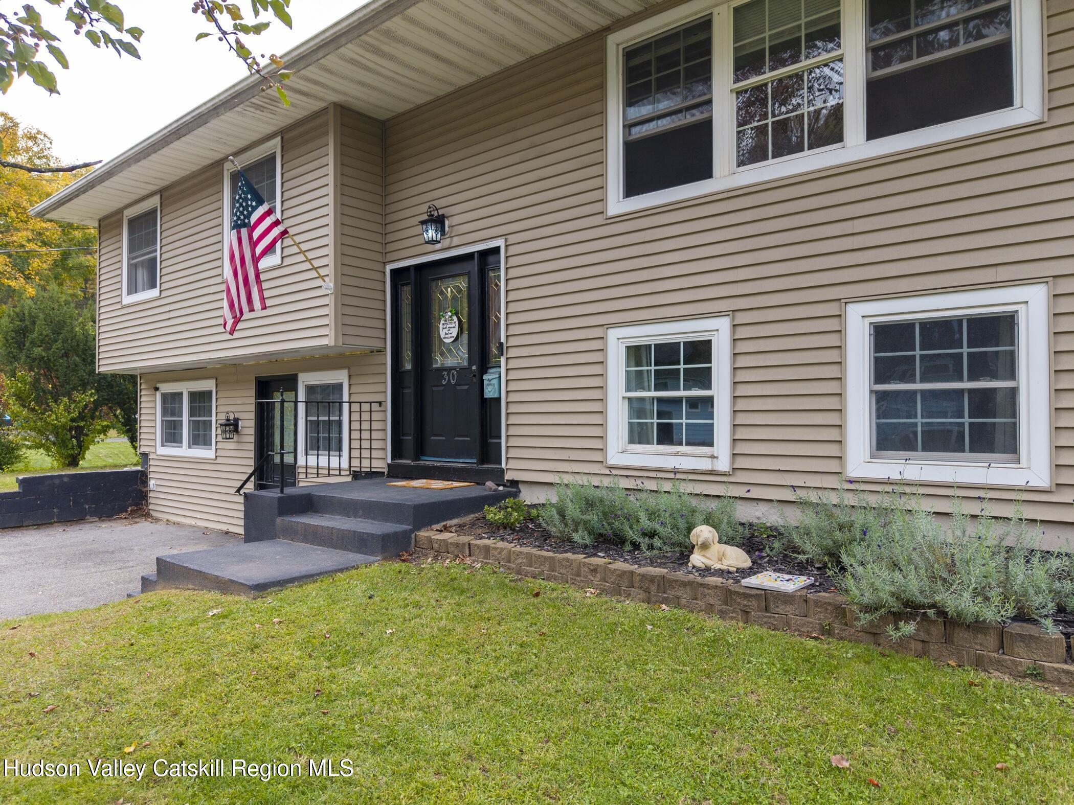 30 Willow Road Saugerties, NY 12477 - Photo 3 of 40 a front view of a house with a yard and outdoor seating