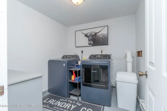 a view of a storage & utility room with washer and dryer