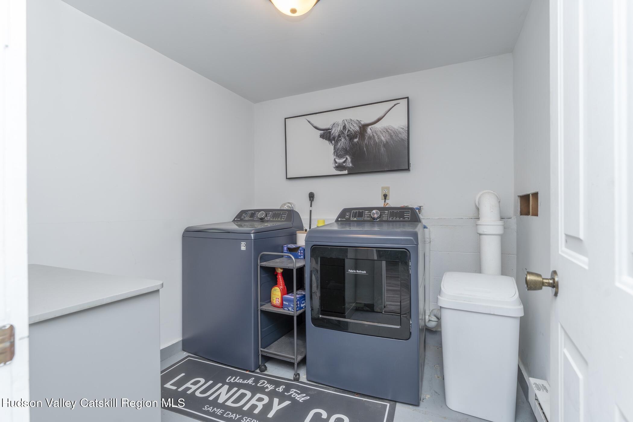 30 Willow Road Saugerties, NY 12477 - Photo 31 of 40 a view of a storage & utility room with washer and dryer