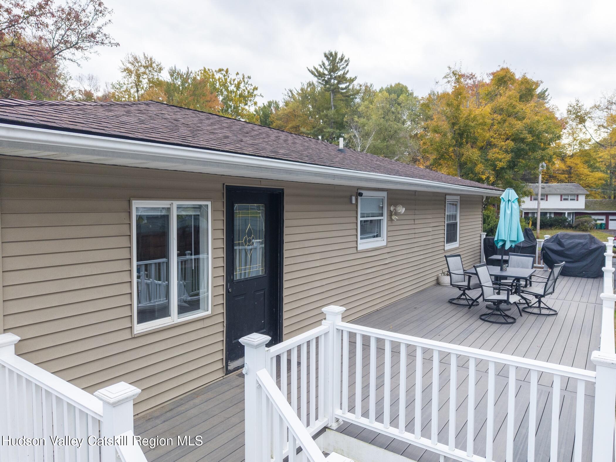 30 Willow Road Saugerties, NY 12477 - Photo 32 of 40 a view of a patio with a table and chairs