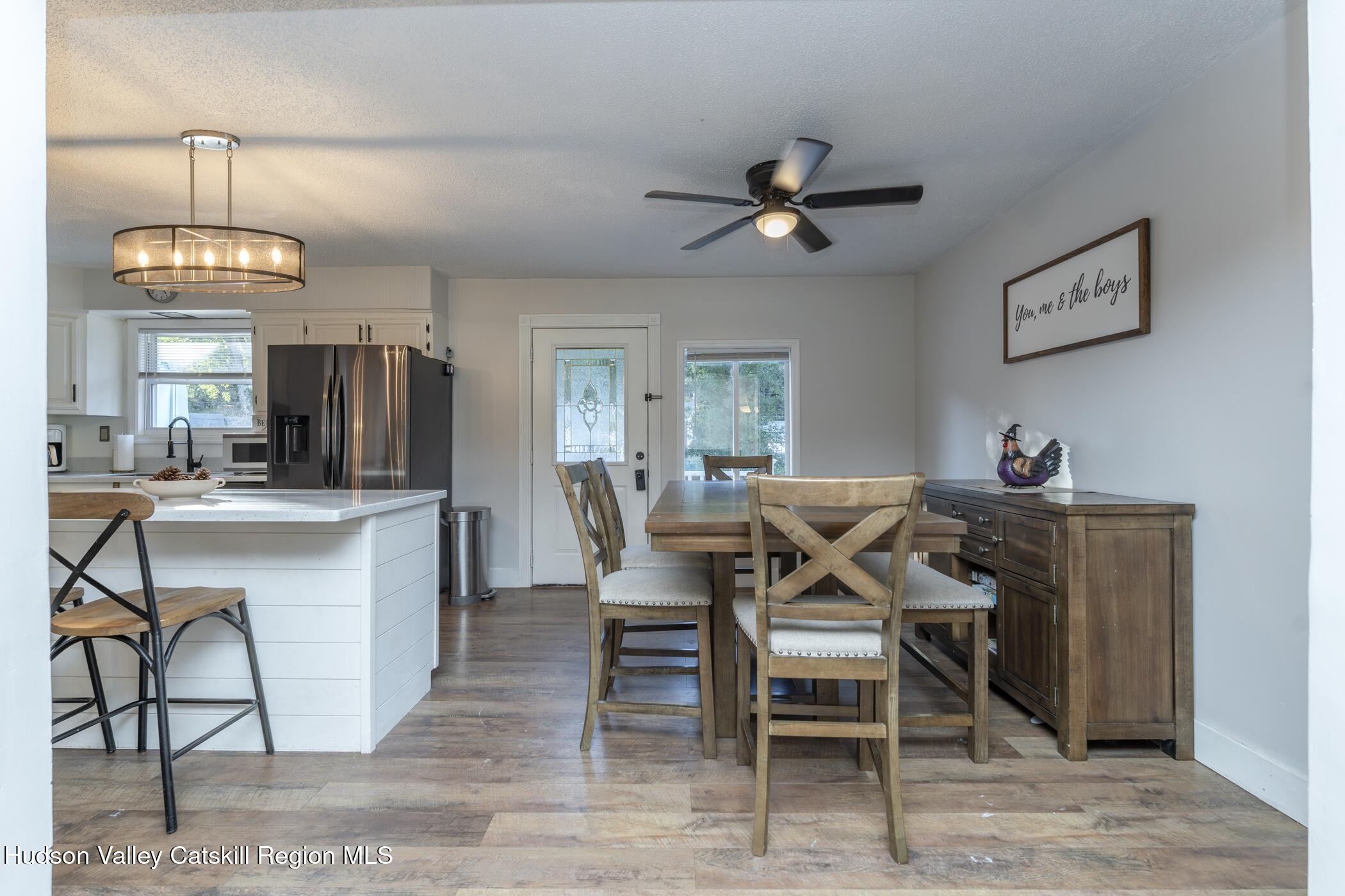 30 Willow Road Saugerties, NY 12477 - Photo 10 of 40 a view of a dining room with furniture and a chandelier