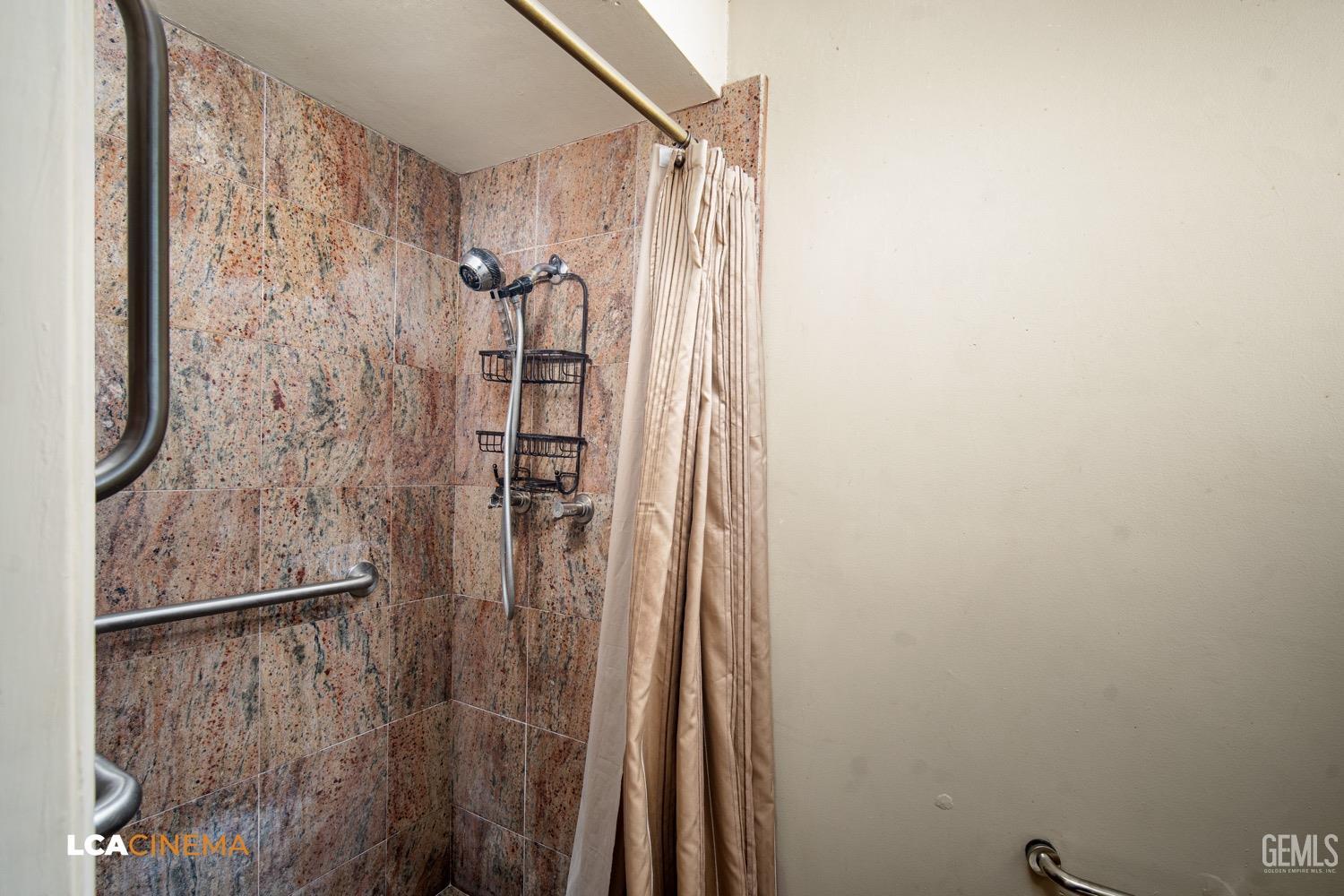 Undisclosed Address Bakersfield, CA 93309 - Photo 19 of 30 a bathroom with a shower