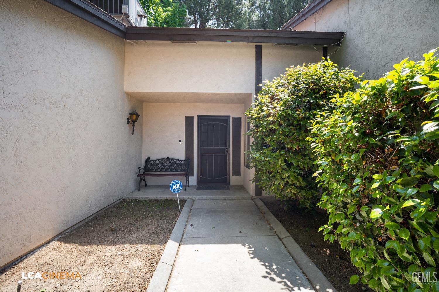 Undisclosed Address Bakersfield, CA 93309 - Photo 20 of 30 a front view of a house with a yard