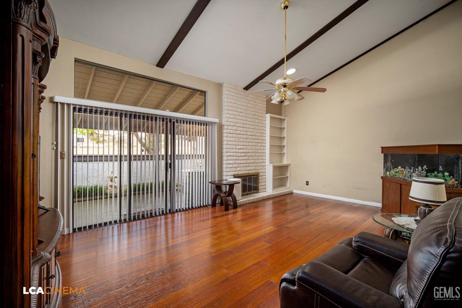 Undisclosed Address Bakersfield, CA 93309 - Photo 5 of 30 an empty room with wooden floor and windows