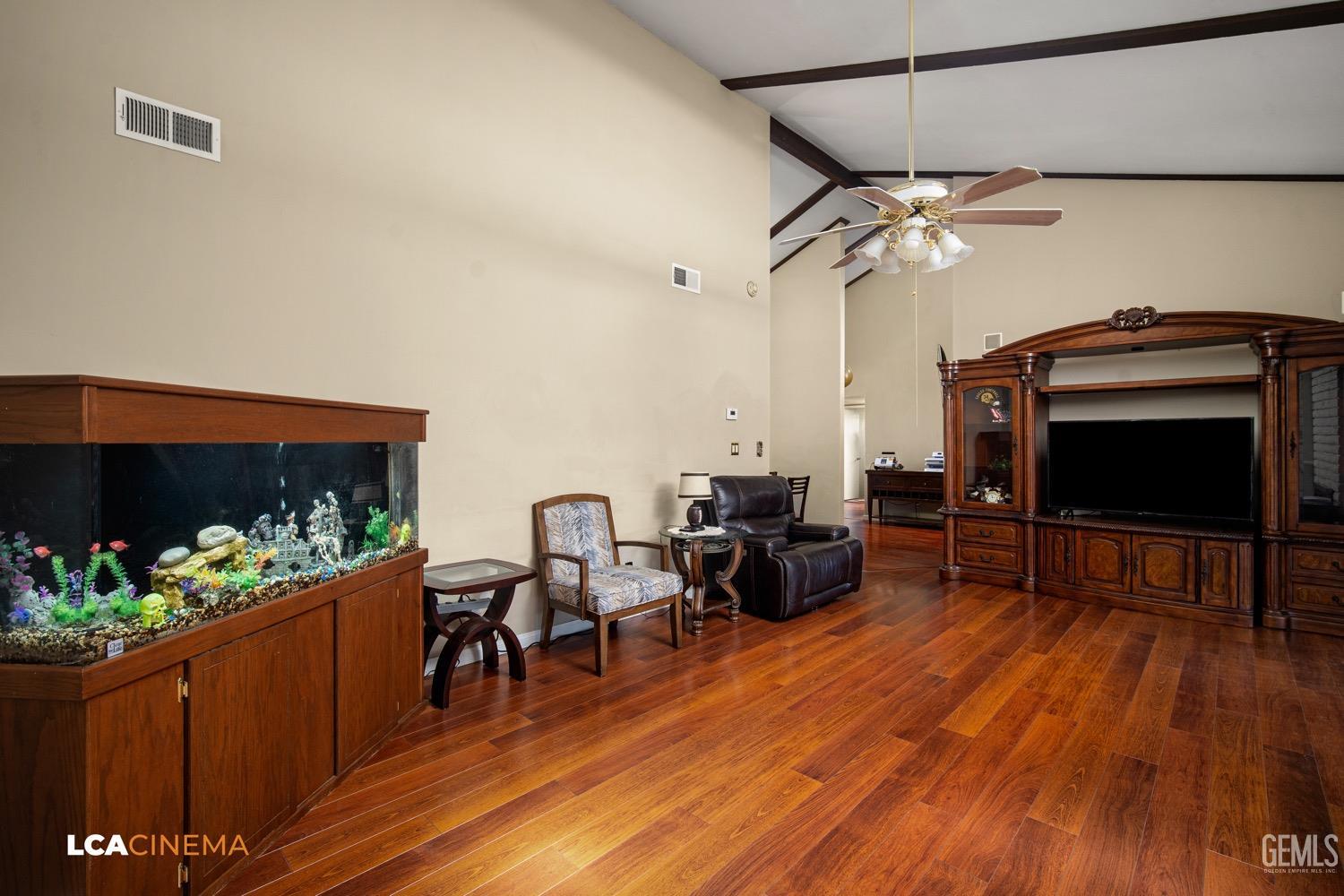Undisclosed Address Bakersfield, CA 93309 - Photo 6 of 30 a living room with furniture and a flat screen tv