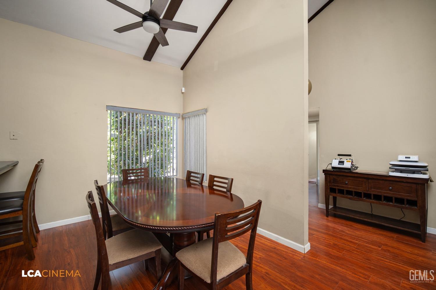 Undisclosed Address Bakersfield, CA 93309 - Photo 7 of 30 a view of a dining room with furniture and wooden floor
