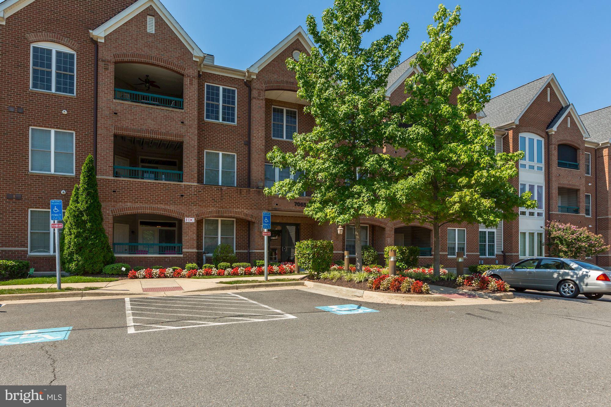 7065 Heritage Hunt Drive, Unit 101 Gainesville, VA 20155 - Photo 2 of 36 Visitor/unassigned parking along front of building