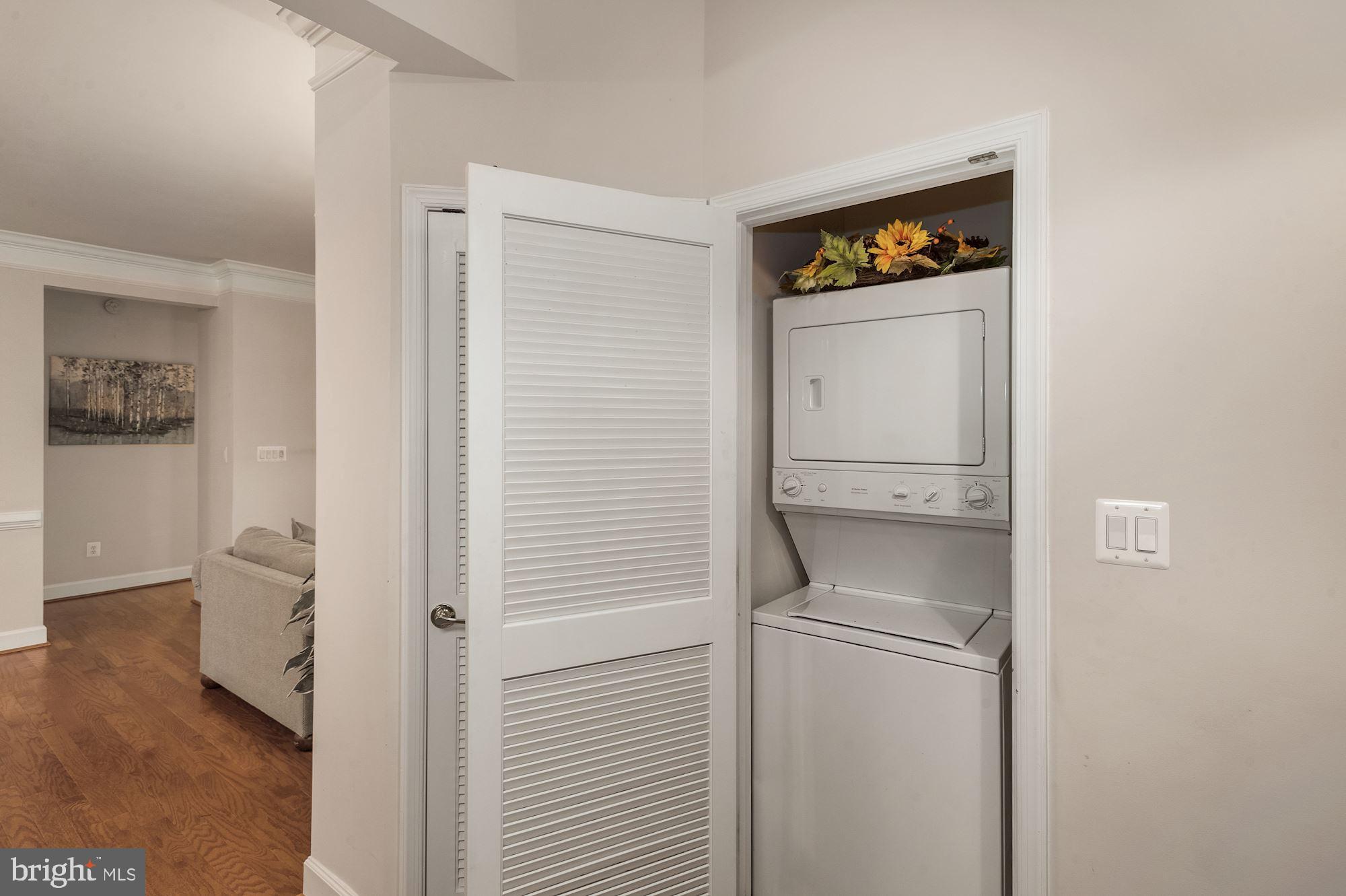 7065 Heritage Hunt Drive, Unit 101 Gainesville, VA 20155 - Photo 13 of 36 Laundry area in kitchen area.