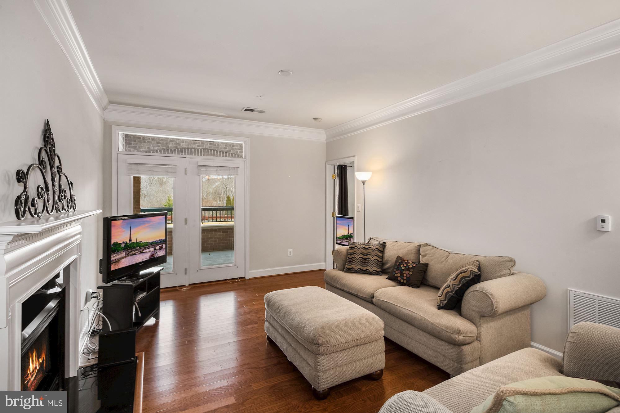 7065 Heritage Hunt Drive, Unit 101 Gainesville, VA 20155 - Photo 14 of 36 Living room pre-wired for ceiling fan or light.