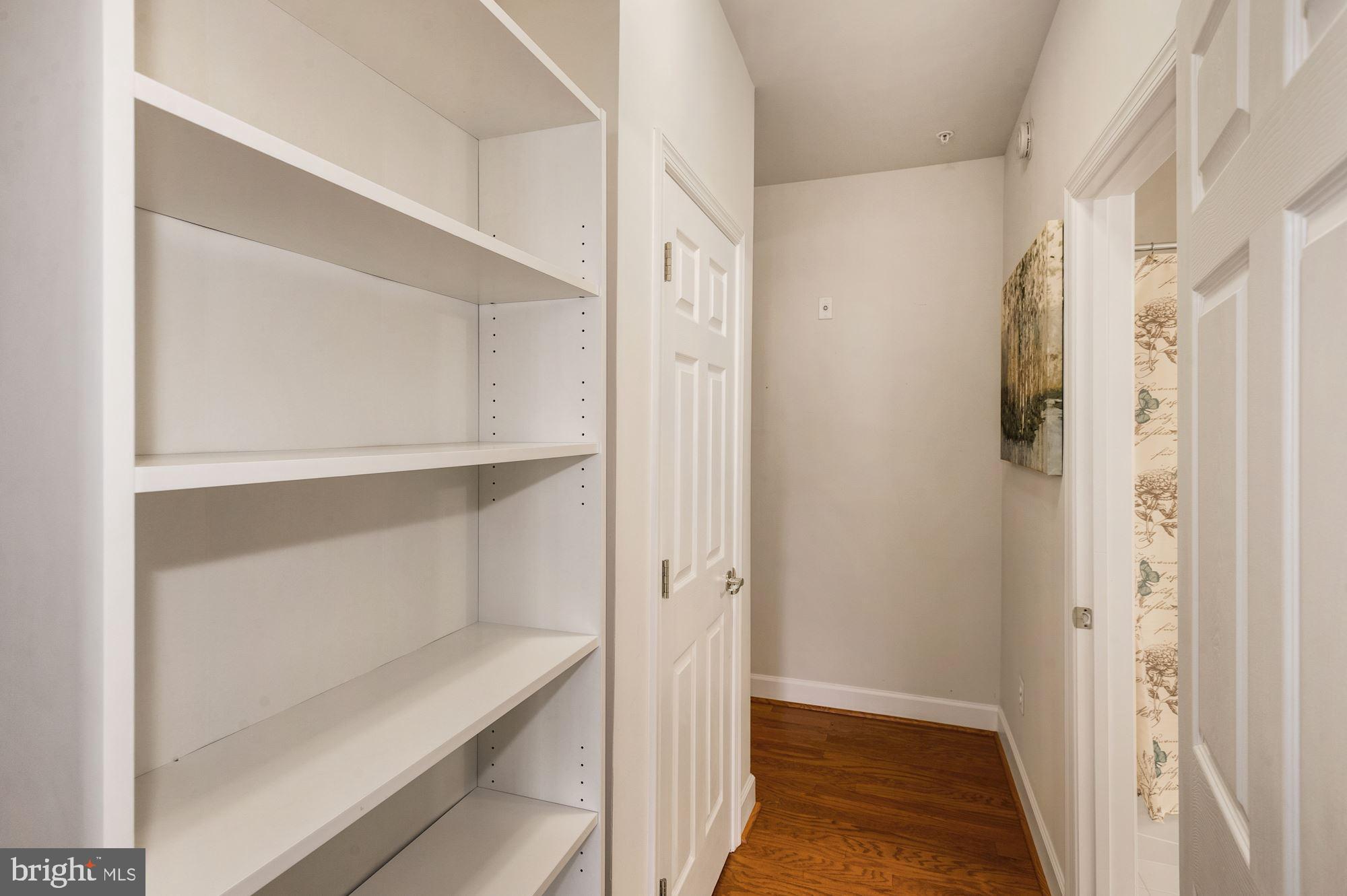 7065 Heritage Hunt Drive, Unit 101 Gainesville, VA 20155 - Photo 24 of 36 Bookcase in hallway is not built-in, but stays.