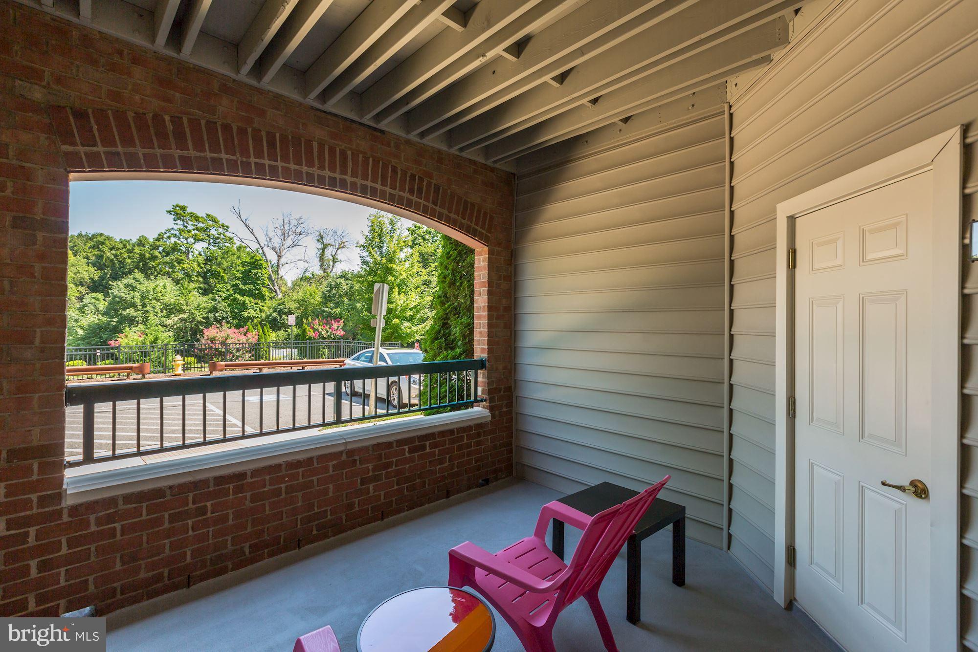 7065 Heritage Hunt Drive, Unit 101 Gainesville, VA 20155 - Photo 26 of 36 Covered patio faces north.