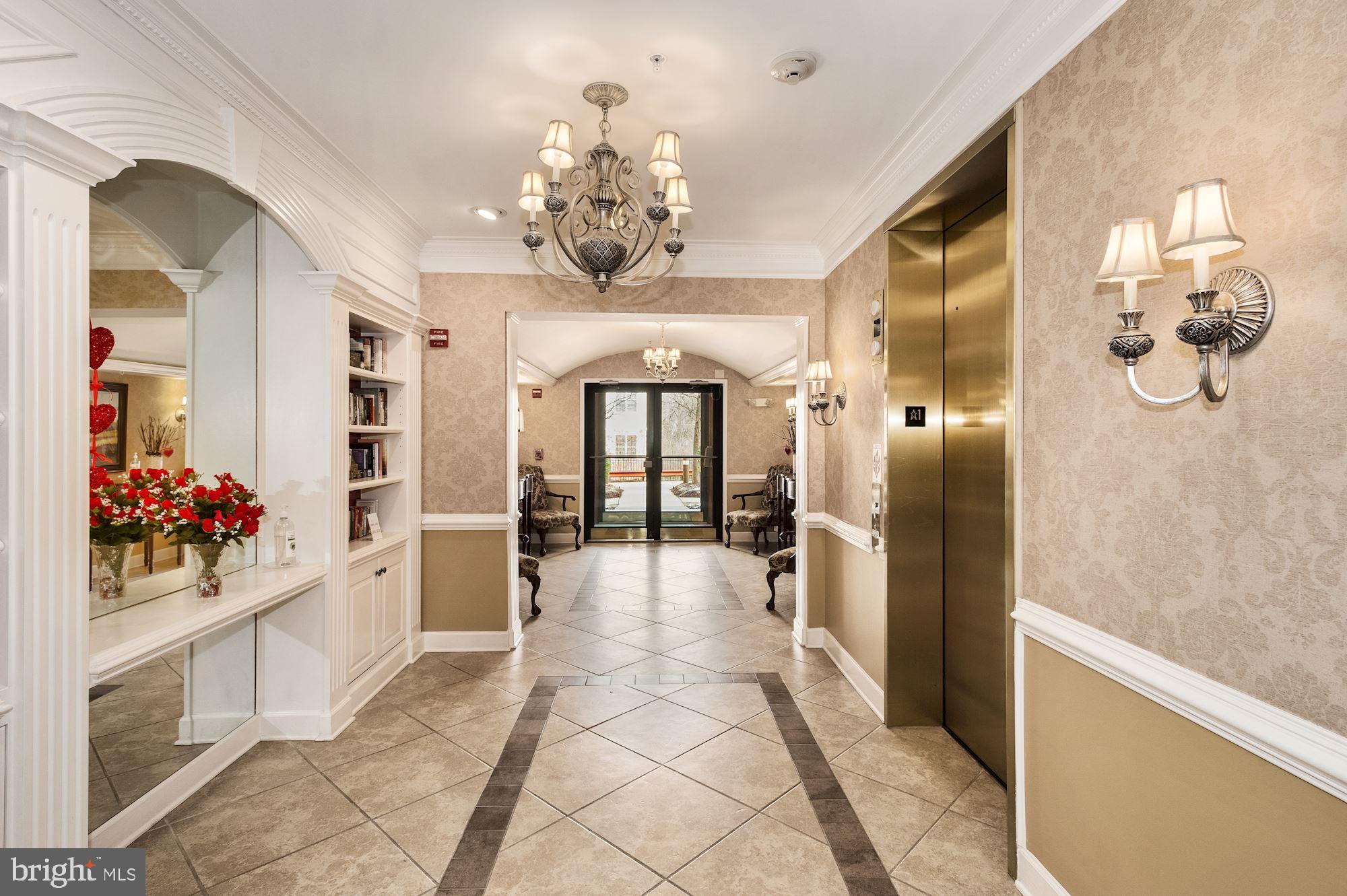 7065 Heritage Hunt Drive, Unit 101 Gainesville, VA 20155 - Photo 6 of 36 Large lobby on first floor.