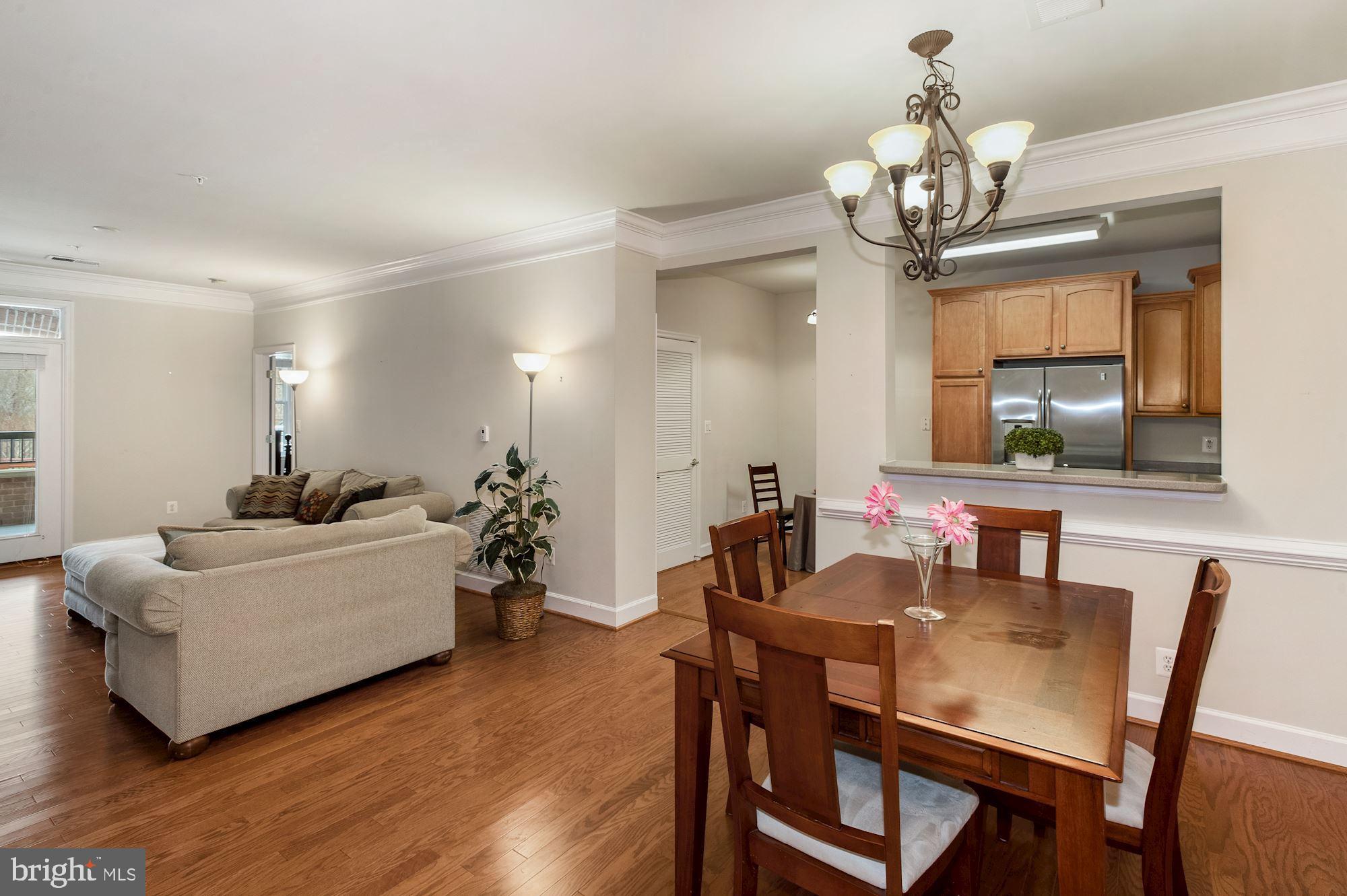 7065 Heritage Hunt Drive, Unit 101 Gainesville, VA 20155 - Photo 36 of 36 Open floor plan with engineered wood floors.