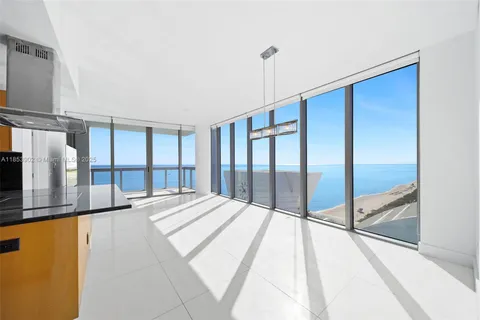 a large bedroom with a large window and a balcony