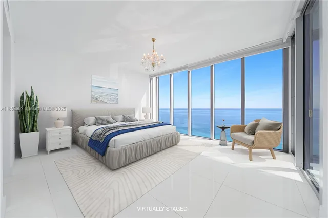 a bedroom with a large bed and a couch